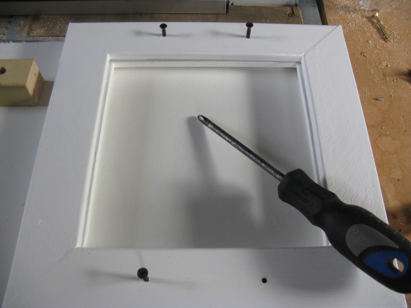 Line up the 2 frames and screw the screws through into the frame you didn't drill